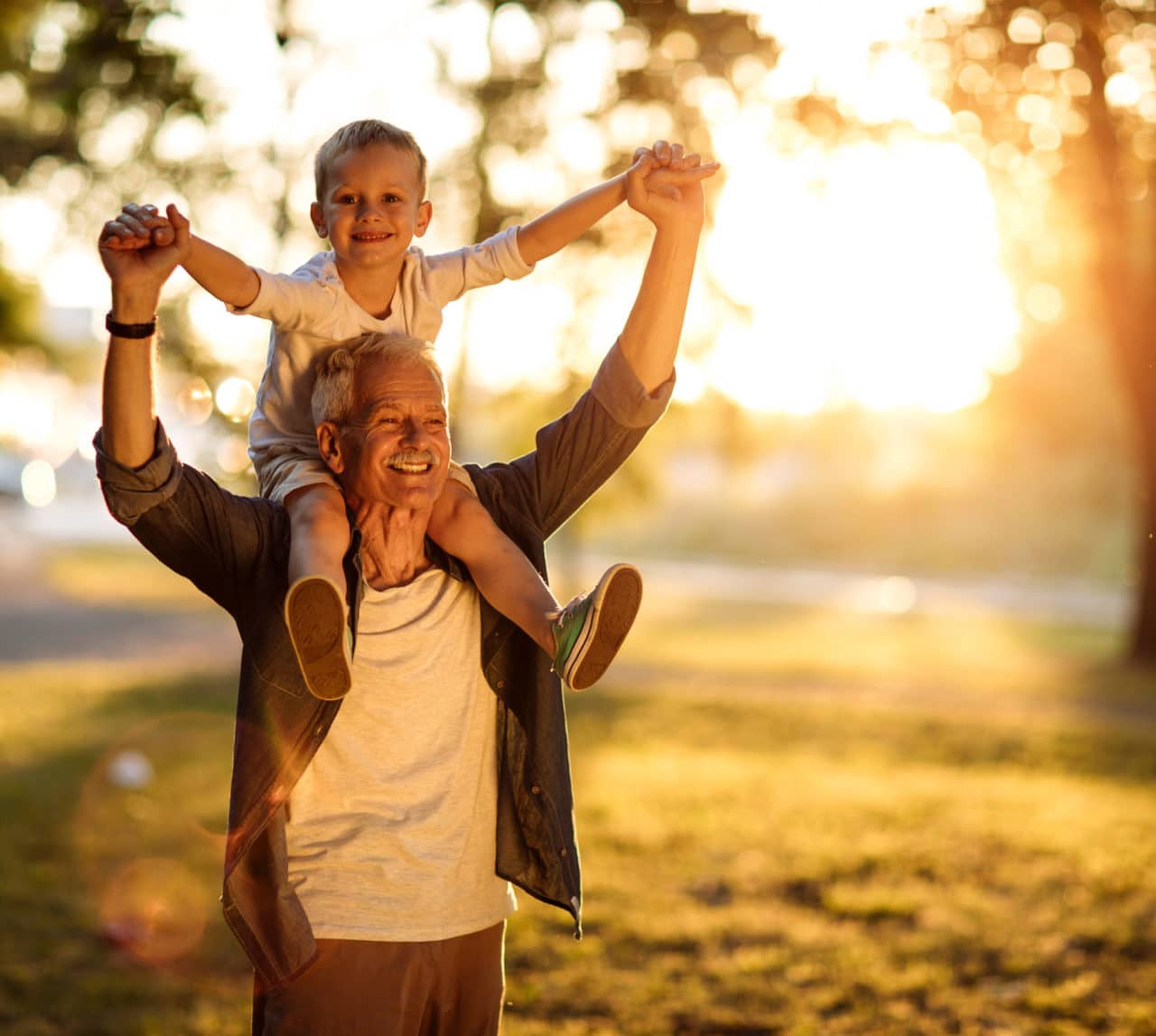 Man with young boy on his shoulders