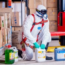 worker wearing proper protection when handling chemicals