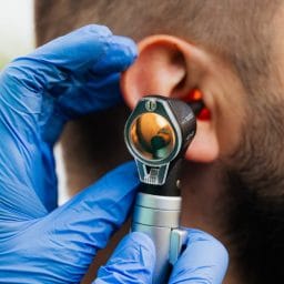 Man gets an ear exam