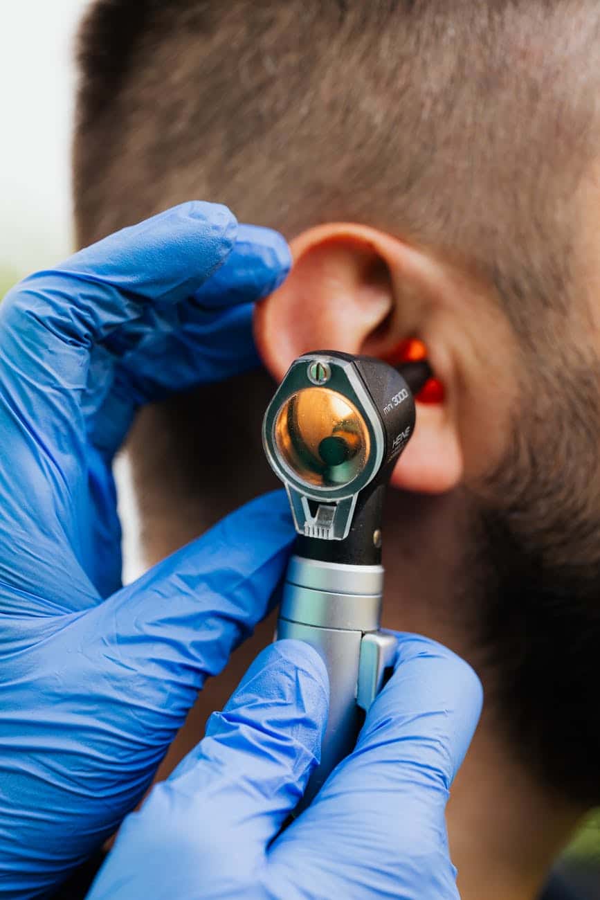 Man gets an ear exam
