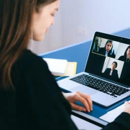 Woman in a virtual work meeting.