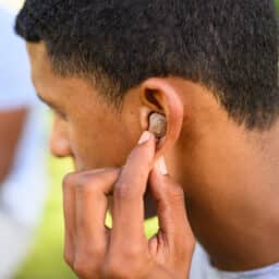 Young man wearing an ITC hearing aid
